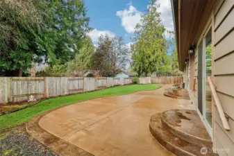Gorgeous patio spanning the width of the house. Slider access to the family room, breakfast nook, and primary bedroom.