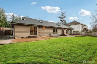 Backyard with gravel space.