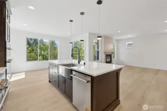 The perfect great room filled with natural light, space, and tree top views