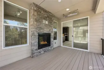 Outdoor living that includes overhead heaters to enjoy year-round. Remote control privacy shade on far end of patio.