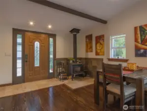 As you enter the home you are welcomed by a nice tiled entrance and beautiful open beam, vaulted ceilings and lots of windows for natural light