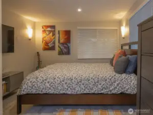 Downstairs enjoy the full primary bedroom with a sitting area and large walk in closet