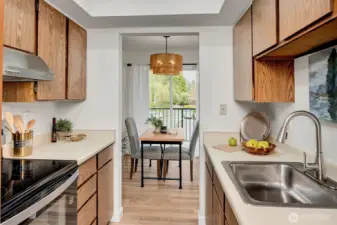 The kitchen offers tons of storage and brand new stainless steel appliances.