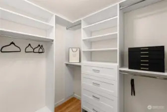 Every wardrobe deserves a home like this. The walk-in closet features thoughtfully designed shelving, ample hanging space, and an organization system tailored for ultimate convenience.