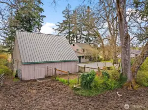 Large barn with water and electric, 2 horse stables and plenty of storage