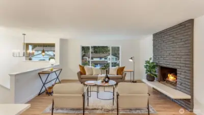 You will love spending cozy nights in this living room with wood burning fireplace, new windows and beautiful light fixtures over the entry.