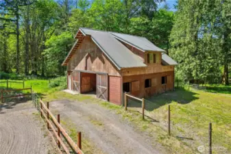 3 stall barn with wash stall, tack room, hay storage and huge loft.