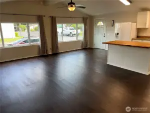 View of living area and kitchen from dining room.