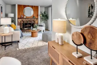 A cozy wood burning fireplace anchors the open Living and Dining rooms.