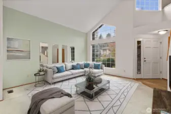 ATTRACTIVE LIVING ROOM IS PERFECT SIZE FOR HOSTING FRIENDS, AND FUN.