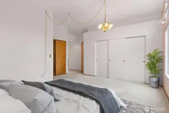 RELAXING PRIMARY BEDROOM UPSTAIRS W/ VAULTED CEILINGS & ACCESS TO A LARGE WALK-IN CLOSET & EN-SUITE FULL BATHROOM.