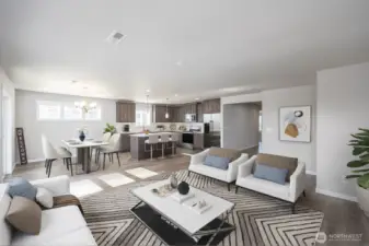virtually staged view from great room into kitchen and dining area