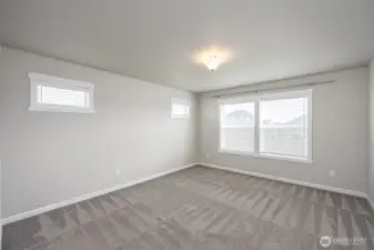 Primary Suite overlooks backyard