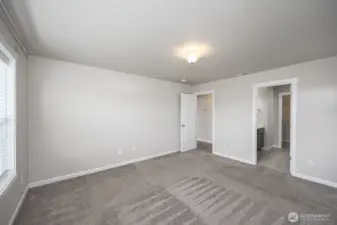 Another view of primary bedroom