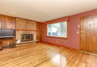 Cozy living room with wood burning fireplace