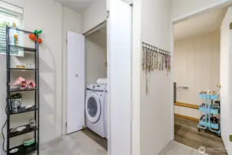 There is a half bath on the ground level next to the rec room and it would be easy to add a third shower.  The laundry closet is also on this ground level and with the amount of space in the garage, you could move the laundry equipment into the garage.