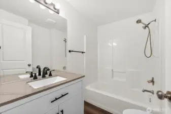 Full Guest Bath w/ New Stone Top Vanity, Toilet, Fixtures, & Easy Care LVP Flooring!