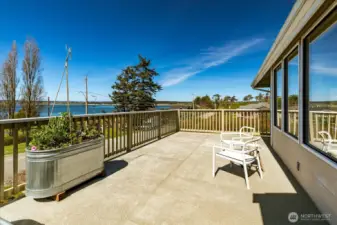 The deck spans most of the entry and living/dining rooms