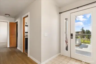 Upon entry into the unit's foyer, to the right is the hallway to the bedrooms and bathrooms