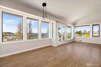 This wall of windows showcases the view while providing a huge amount of natural lighting throughout