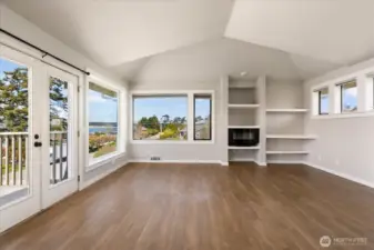 This central part of the living room, with its vaulted ceiling, provides plenty of room for entertaining, especially with the glorious views and french doors to the deck
