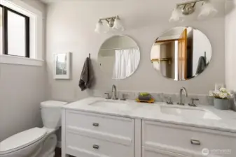 Double sink updated cabinetry, mirrors and lighting in the master bath. Full tub/shower.