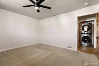 Looking from primary back to hallway and laundry closet.