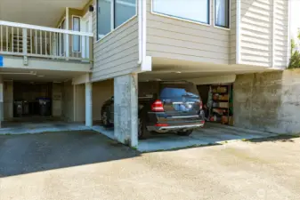 Assigned covered parking spot under building. There are stairs up from inside the garage, as well as an outside walkway/stairs for entry