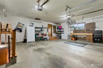 Good sized garage space. Stairs to left side enter the in-law suite with kitchenette.