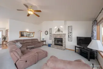 Living room with wood burning fireplace