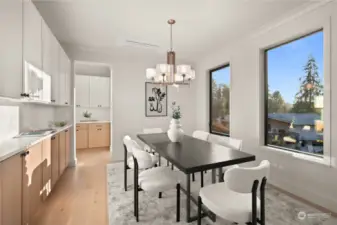 Formal dining space overflowing with natural light and beautiful custom built-in cabinetry.