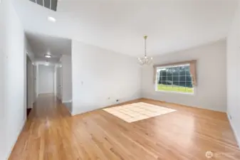 Between the entry & the kitchen is the roomy formal dining room.  Lovely hardwood floors