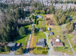 This shows the Manuf. Home in front & the custom built home in the back.