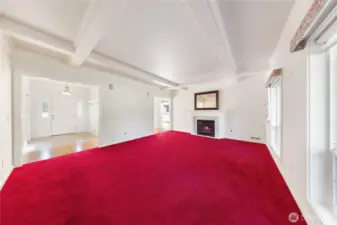 Formal front entry opens to the spacious living room w/boxed ceiling features as well as a gas fireplace