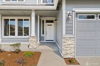 Stone panels on home & garage. Photos of a similar home, not actual, for illustration only.