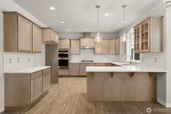 Maple cabinetry with full extension guides and soft close drawers. Photos of a similar home, not actual, for illustration only.