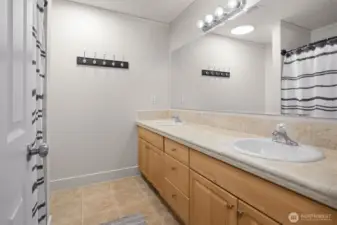 Full bath off the hall with refreshed vanities and dual sinks