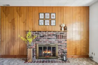 Cozy wood fire with brick detail