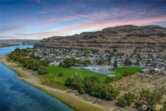 Welcome to your ideal vacation getaway and investment property nestled in coveted Sunland Estates, a vibrant riverside community full of recreation and charm