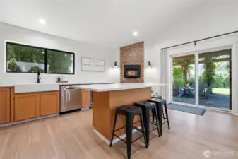 Bright and airy, the island is shown against a backdrop of sunlit windows. Ideal for meal prep or packing the cooler for your day on the river