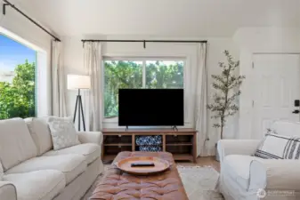 Designer furnishings and a soothing neutral palette to create a warm, inviting space to relax or catch up on shows