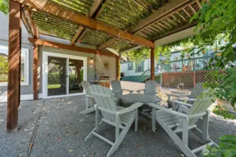 When the grill is going and friends are near—this shady vine-covered patio gazebo is made for summer celebrations, dinner al-fresco, and sunset drinks