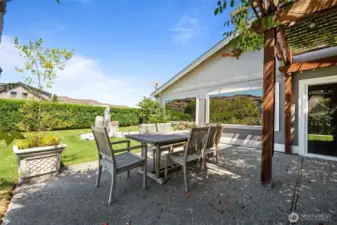 Dine al fresco at this vine-covered gazebo on the spacious rear patio—your shady retreat for refreshing drinks and sunset meals