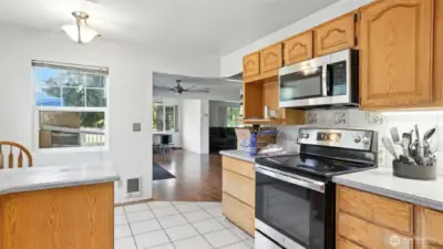 Kitchen offers an informal dining space and open sight lines to the larger dining room and living room, ideal for entertaining!