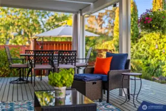 Private entrance to covered back deck off primary