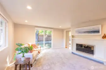 Sliding door opens to a spacious backyard.