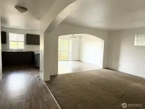 Open concept living area with beautiful arches.