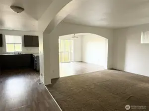 Open concept living area with beautiful arches.