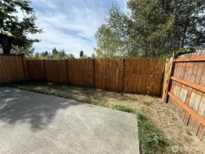 Cozy backyard with lots of potential.