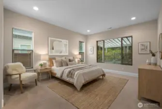 Serene primary suite with large privacy windows, a full tile shower, ceramic tile floors, granite countertops with a double vanity, and large walk in closet.